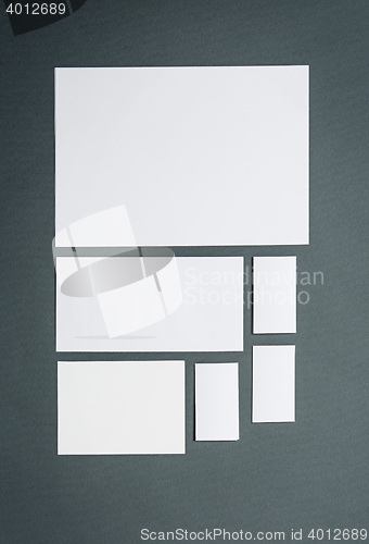 Image of Mock-up business template with cards, papers. Gray background.