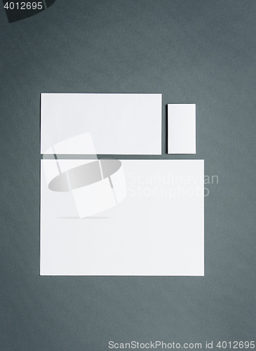 Image of Mock-up business template with cards, papers. Gray background.