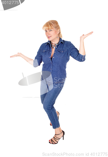 Image of Woman standing gesturing with hands.