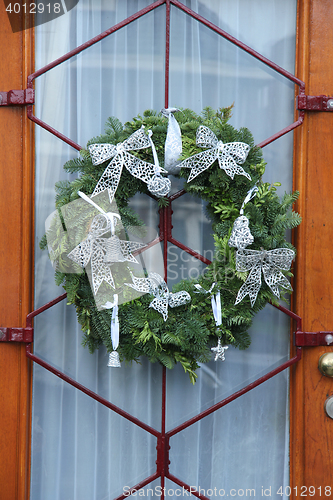 Image of Christmas wreath on a glass door