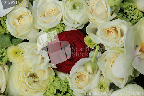 Image of Red rose in white bridal bouquet