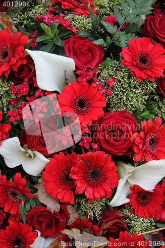 Image of Floral arrangement in red and white