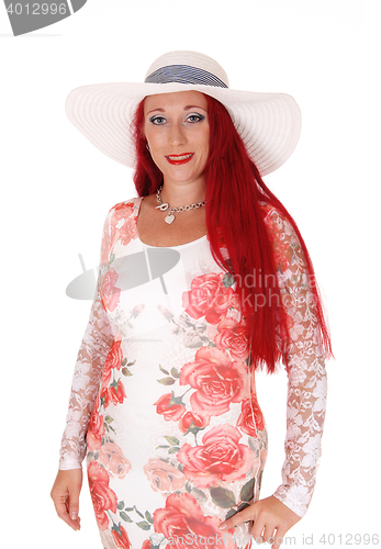 Image of Gorgeous woman in dress and hat.