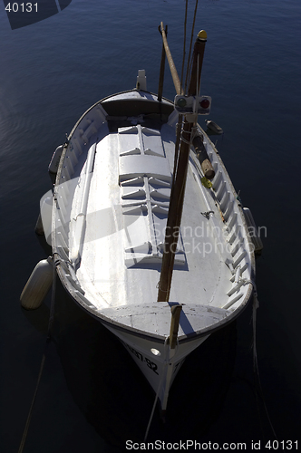 Image of Single wooden white fishing boat