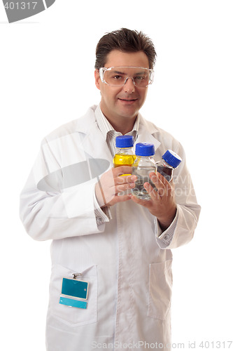 Image of Laboratory chemist holding bottles of chemicals