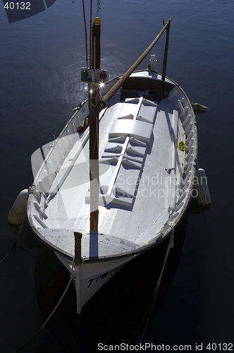 Image of Single wooden white fishing boat