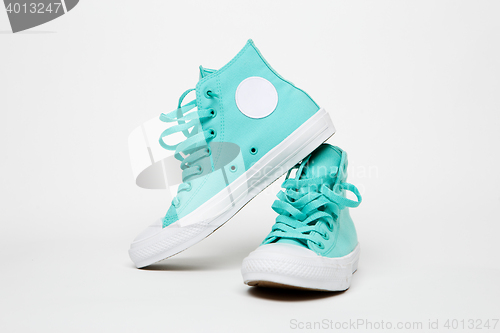 Image of Turquoise sneakers on blank white background