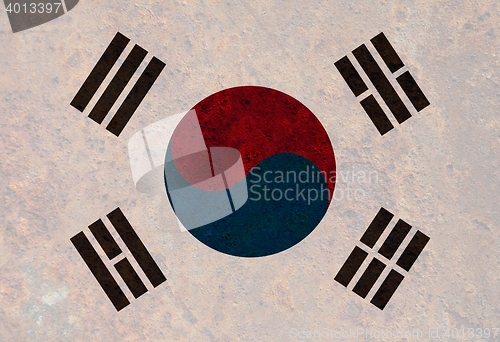 Image of Flag on rusty metal