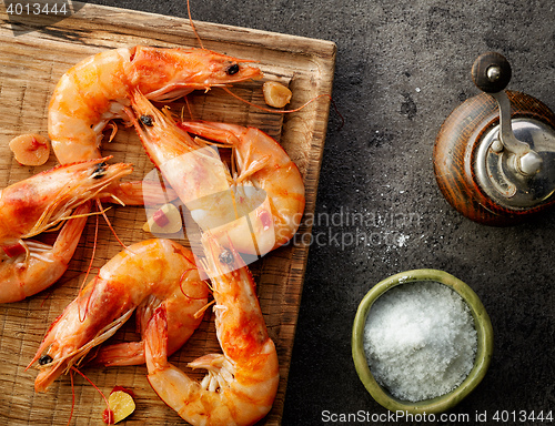 Image of roasted prawns on wooden cutting board