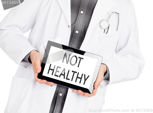 Image of Doctor holding tablet - Not healthy