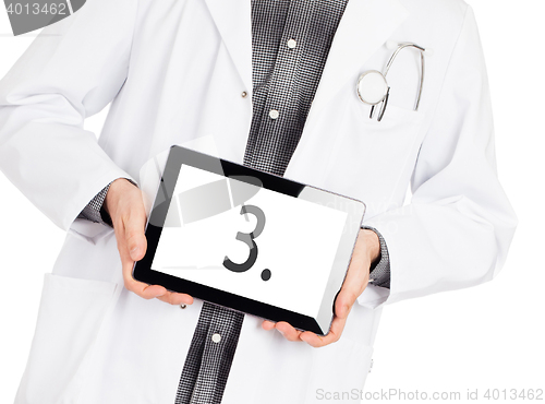 Image of Doctor holding tablet - Number 3