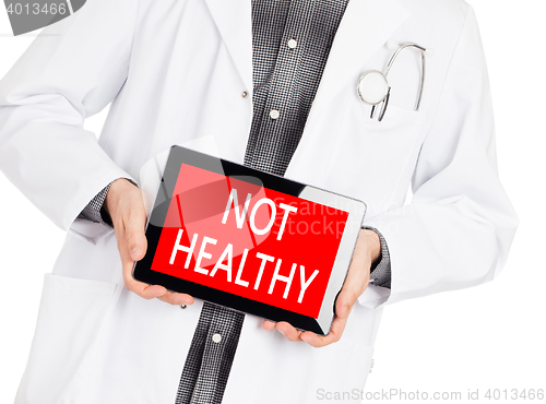 Image of Doctor holding tablet - Not healthy