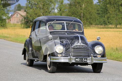 Image of Black BMW 340 Classic Car Cruising along Country Road