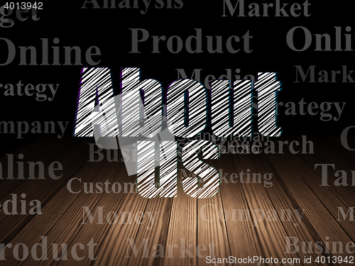 Image of Advertising concept: About Us in grunge dark room