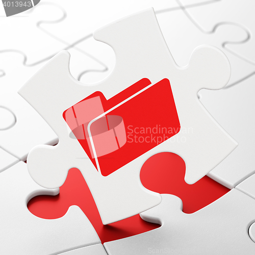 Image of Finance concept: Folder on puzzle background