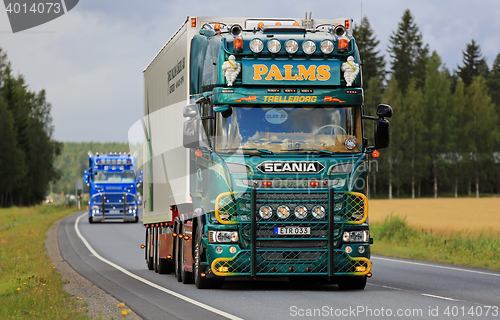 Image of Green Customized Scania V8 Palms in Truck Convoy