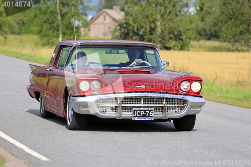 Image of Red Ford Thunderbird Hardtop 1960 on the Road