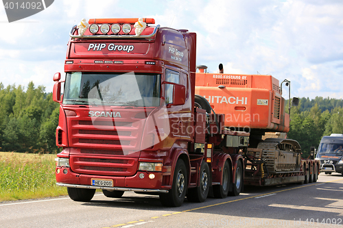 Image of Red Scania Semi Transports Construction Machinery Uphill