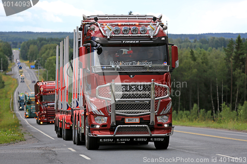 Image of Red Sisu Polar Logging Truck in Convoy