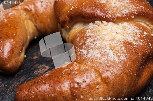 Image of Tasty croissant on wooden background