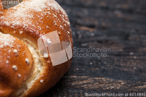 Image of Rustic bread on wood table. Dark woody background with free text space.