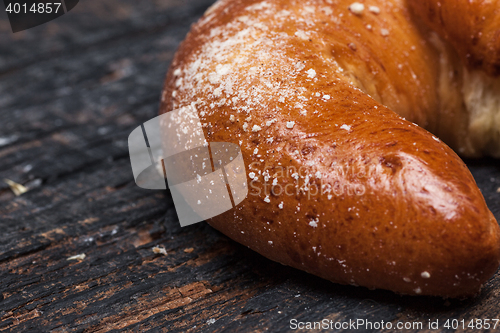 Image of Tasty croissant on wooden background