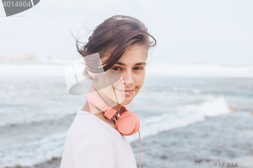 Image of Woman walking on the beach