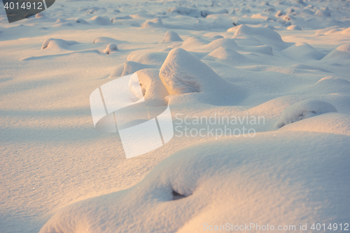 Image of landscape. weather, snowdrifts in the foreground