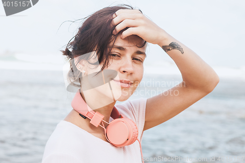 Image of Woman walking on the beach