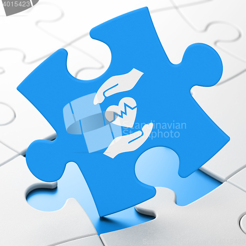 Image of Insurance concept: Heart And Palm on puzzle background