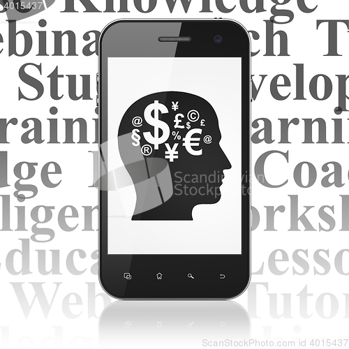 Image of Education concept: Smartphone with Head With Finance Symbol on display