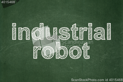 Image of Industry concept: Industrial Robot on chalkboard background
