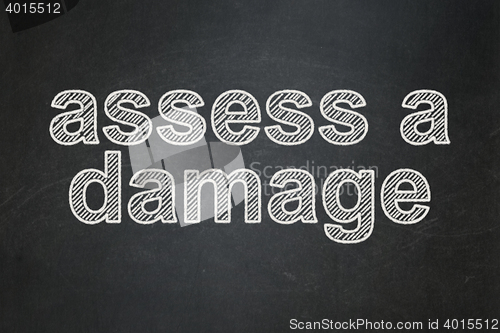 Image of Insurance concept: Assess A Damage on chalkboard background