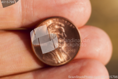 Image of coin in hand