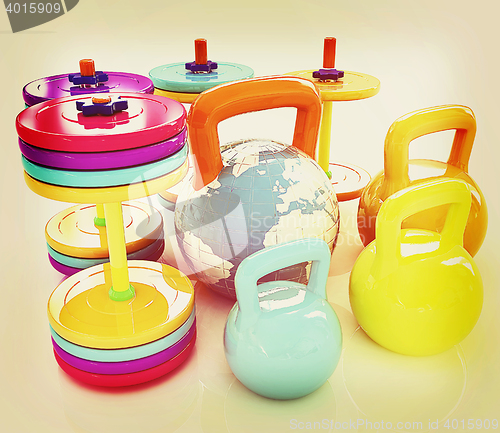 Image of Colorful weights and dumbbells and earth. Global . 3D illustrati