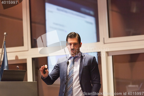 Image of Speaker giving talk at Business Conference.