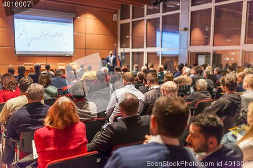 Image of Business speaker giving a talk in conference hall.