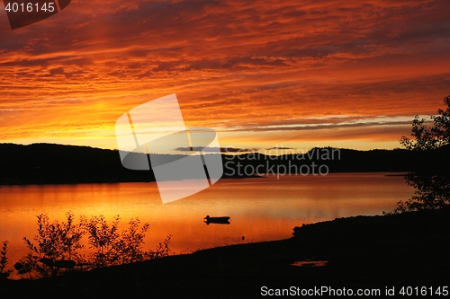 Image of Red sky over mountain lake