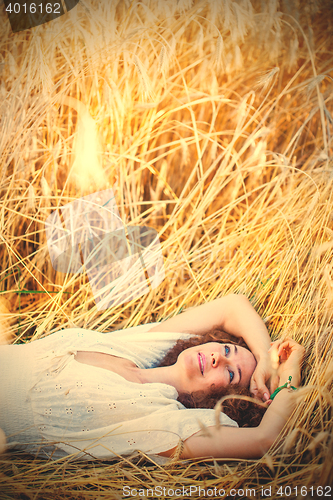 Image of woman lying in the grass