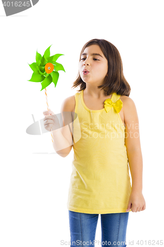 Image of Girl blowing a windmill