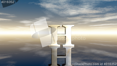 Image of metal uppercase letter h under cloudy sky - 3d rendering