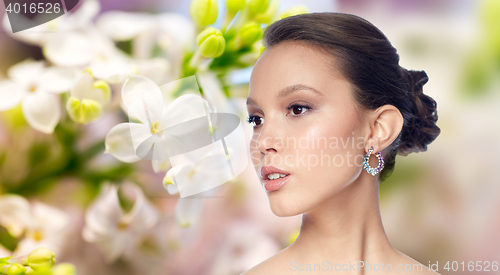 Image of close up of beautiful woman face with earring