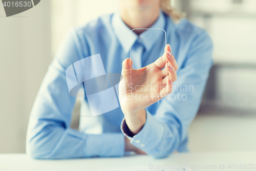 Image of close up of woman with transparent smartphone