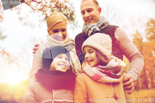 Image of happy family in autumn park