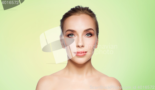 Image of beautiful young woman face over white background