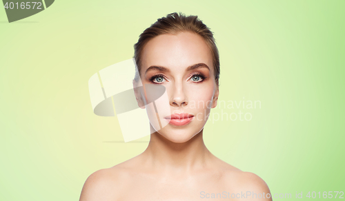Image of beautiful young woman face over white background