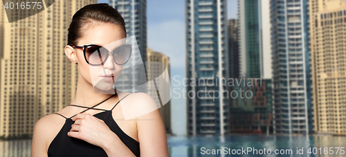 Image of beautiful young woman in elegant black sunglasses