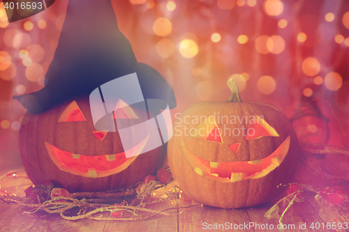 Image of close up of carved halloween pumpkins on table