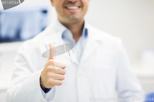 Image of close up of doctor showing thumbs up at hospital