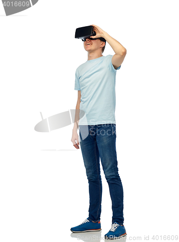 Image of happy man in virtual reality headset or 3d glasses